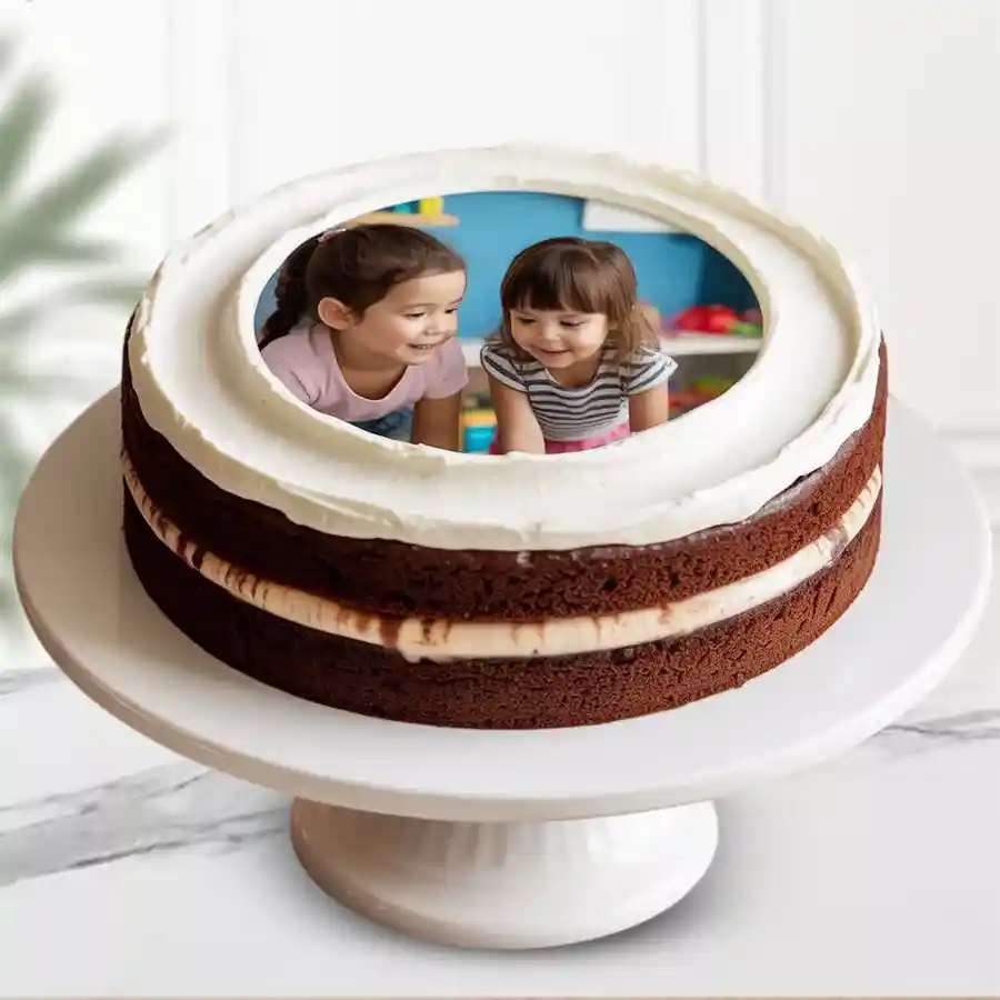 Round chocolate photo cake with personalized image on top.