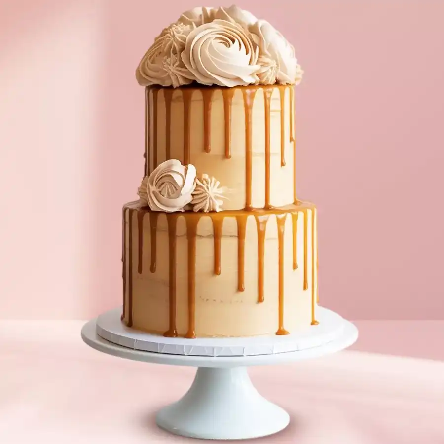 Irresistible Two-Tier Butterscotch Bliss cake with caramel drizzle and floral toppings.
