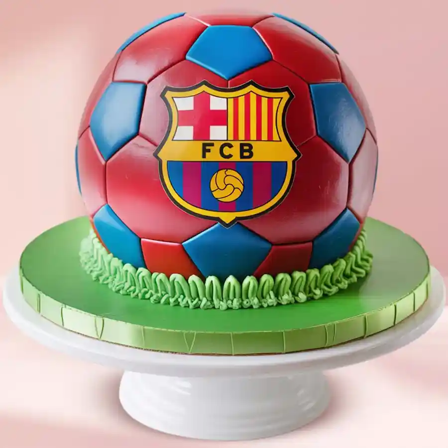 Chocolate cake shaped like a football, decorated in Barcelona team colors with the logo.