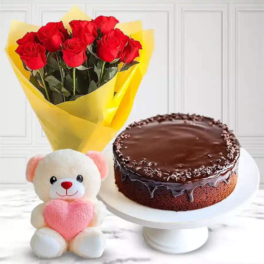 Gift combo featuring an eggless chocolate cake, 10 red roses, and a small teddy bear.