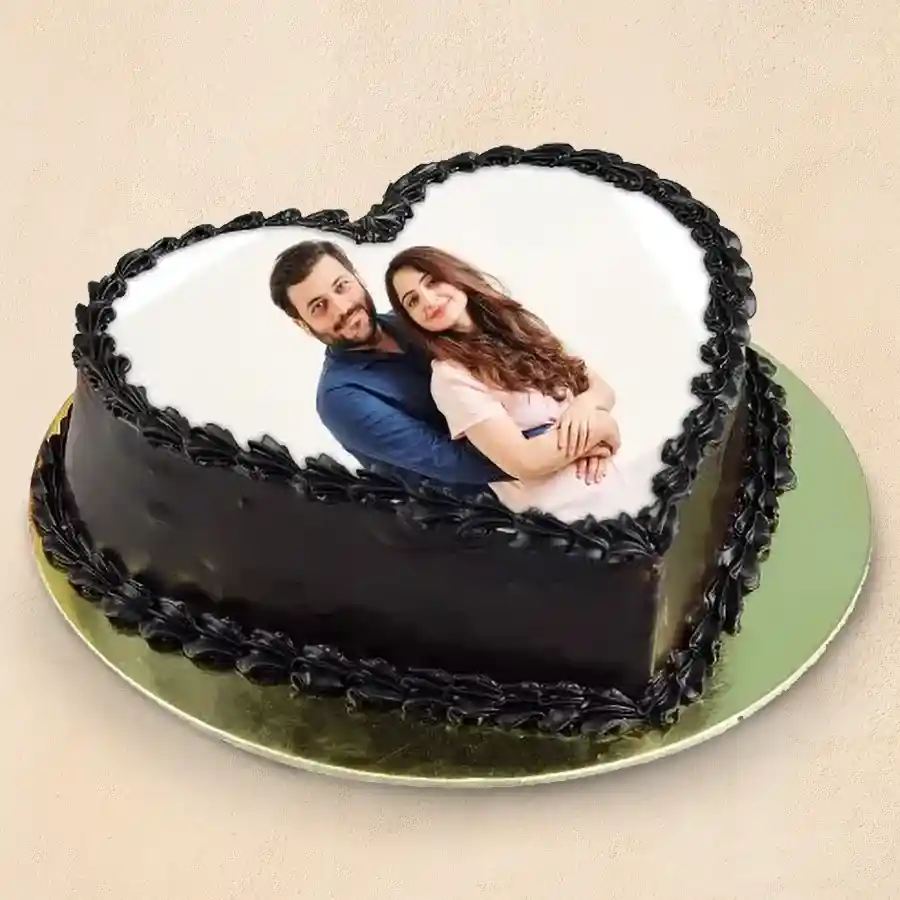 A personalized 500 gms Chocolate Photo Cake ready for celebration with an edible photo on top.