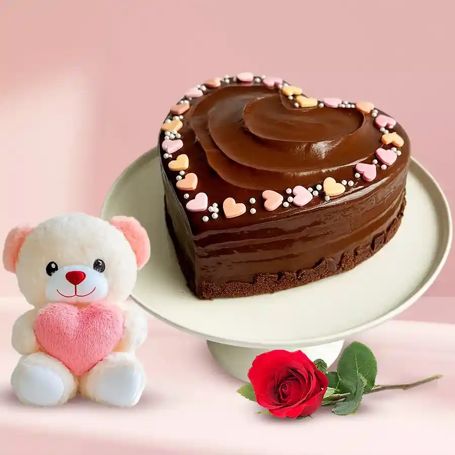 Romantic Delight Gift Set featuring a heart-shaped cake, red rose, and small teddy bear for special occasions.
