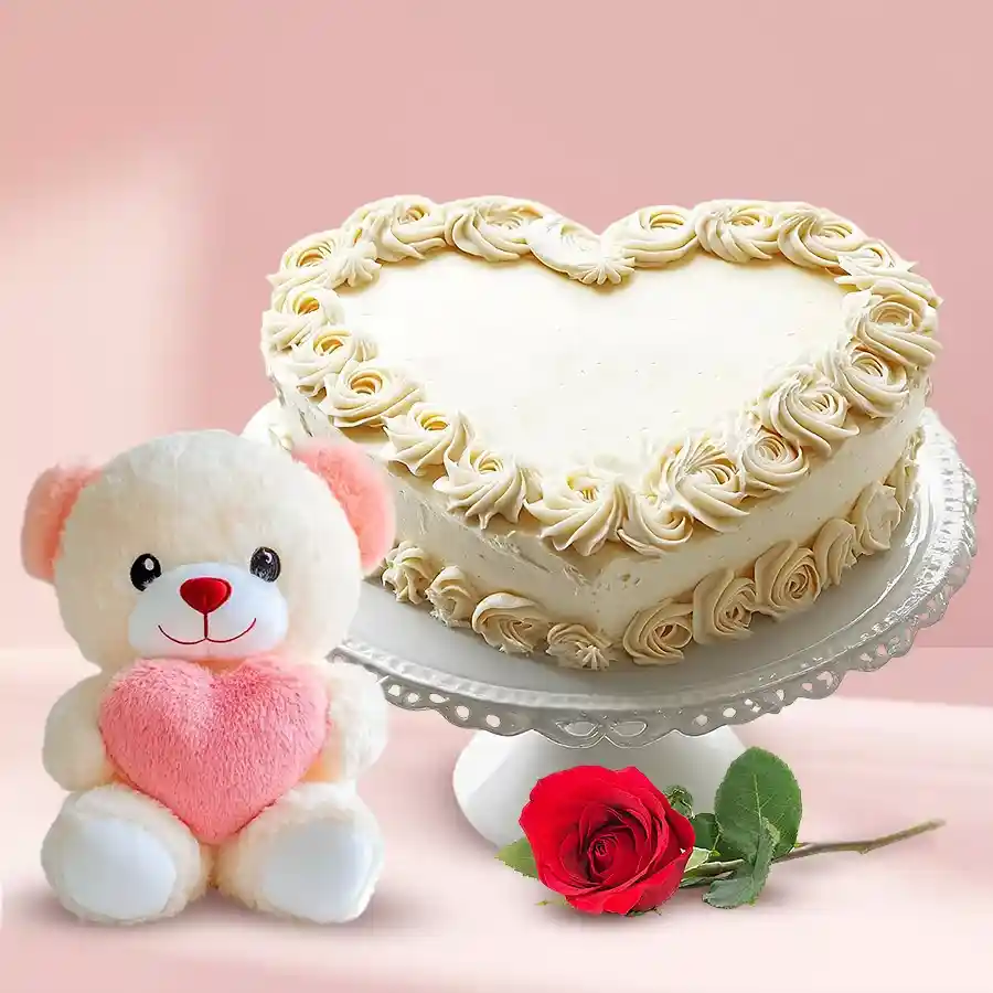 Heartfelt gift set featuring a heart-shaped vanilla cake, a single rose, and a small teddy bear. Perfect for expressing love and affection.