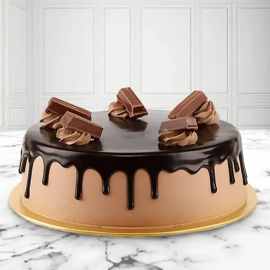A delightful 1/2 kg Kitkat Cake, perfect for surprising loved ones with rich chocolate layers and crunchy Kitkat bars.