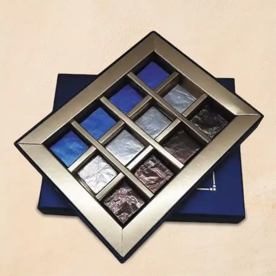 Assorted dried fruits filled chocolates in an elegant royal blue box