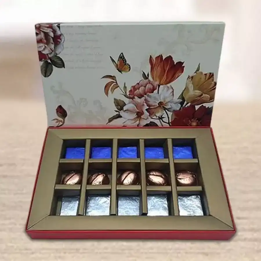 A beautifully arranged box of 15 handmade chocolates filled with dried kiwi, mango, and pineapple, showcasing a vibrant and colorful display.