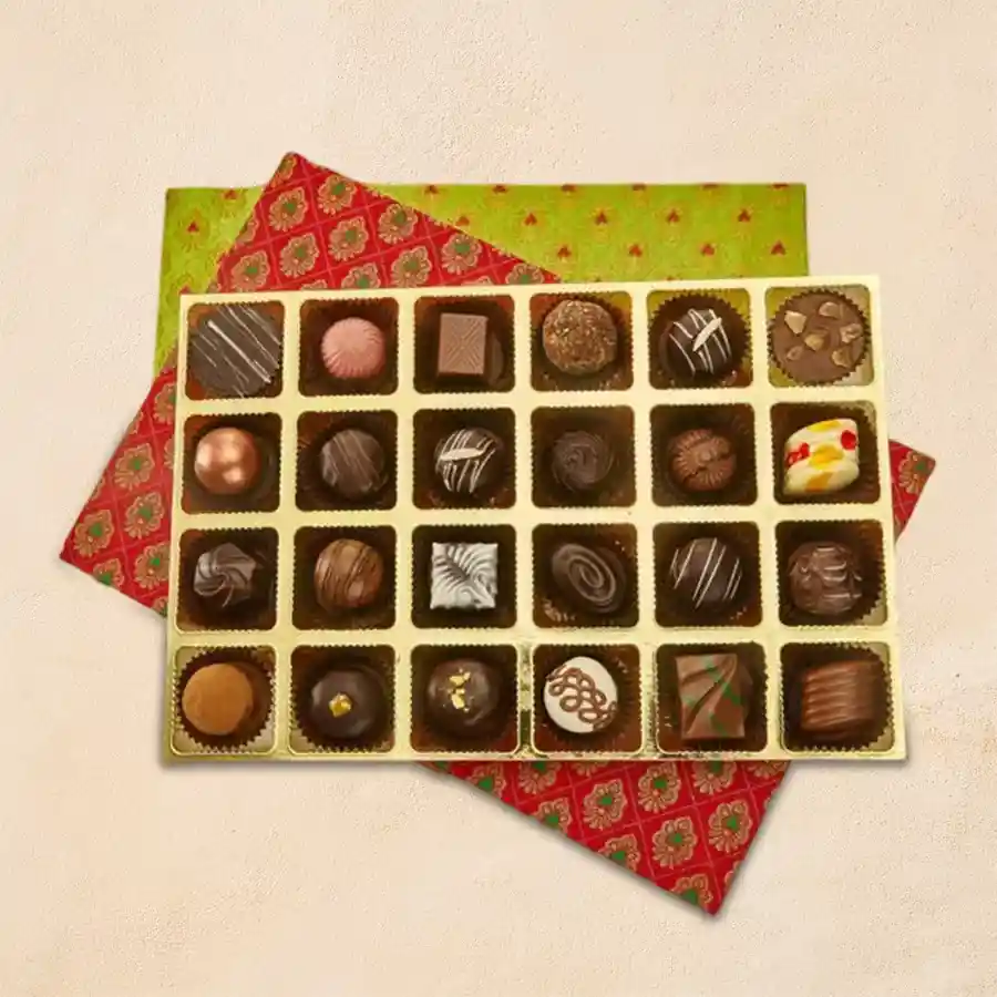 Box of 24 handmade rum-filled chocolates elegantly wrapped with a white ribbon