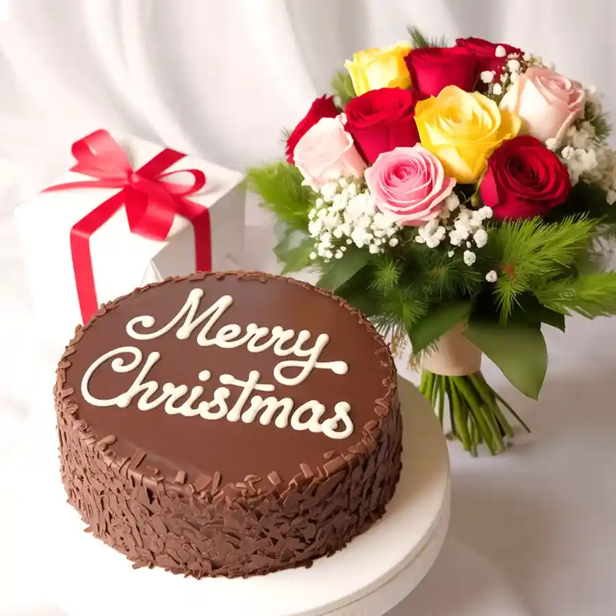 A bouquet of mixed roses alongside a Merry-Xmas chocolate cake, perfect for holiday celebrations.