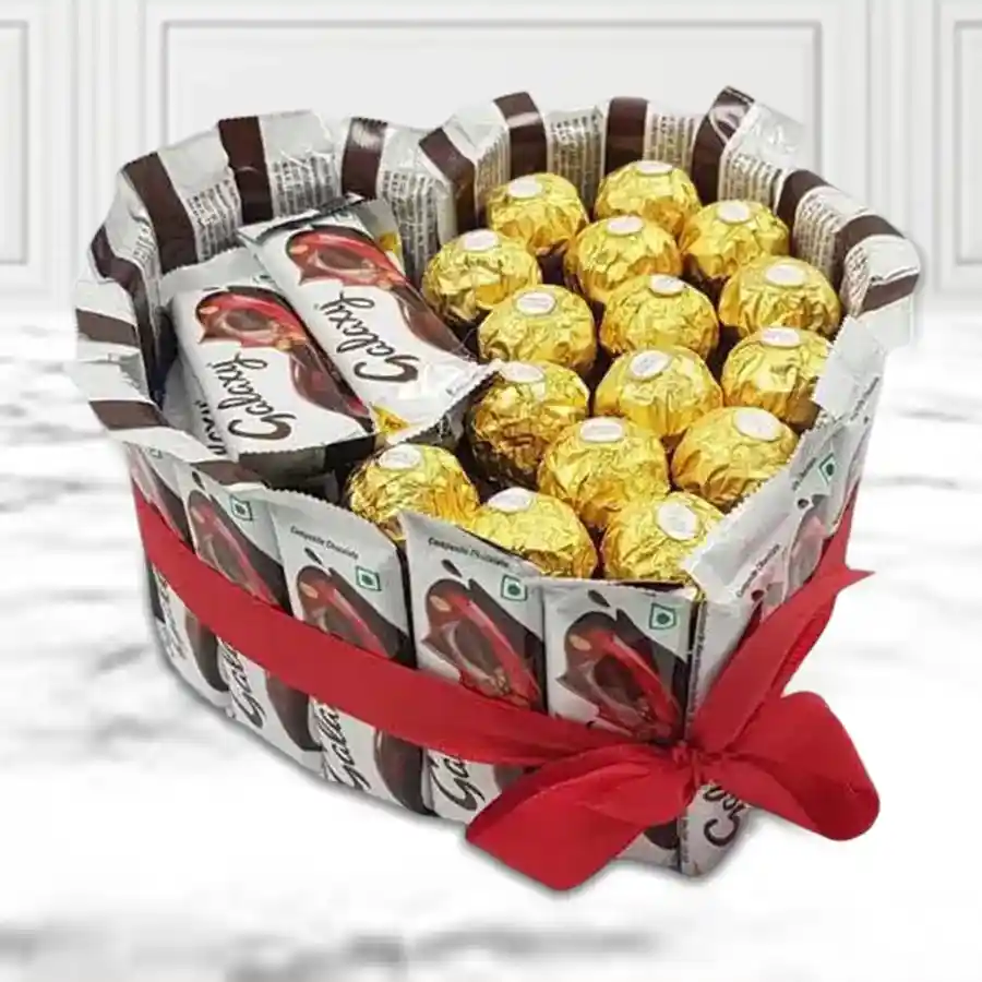 Heart-shaped arrangement of Ferrero Rocher and Galaxy chocolates