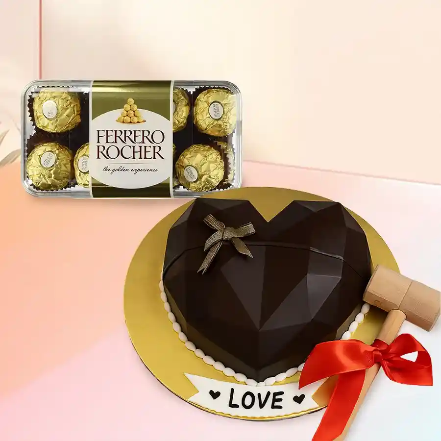 Heart-shaped piñata cake with hammer and 16 Ferrero Rocher chocolates.
