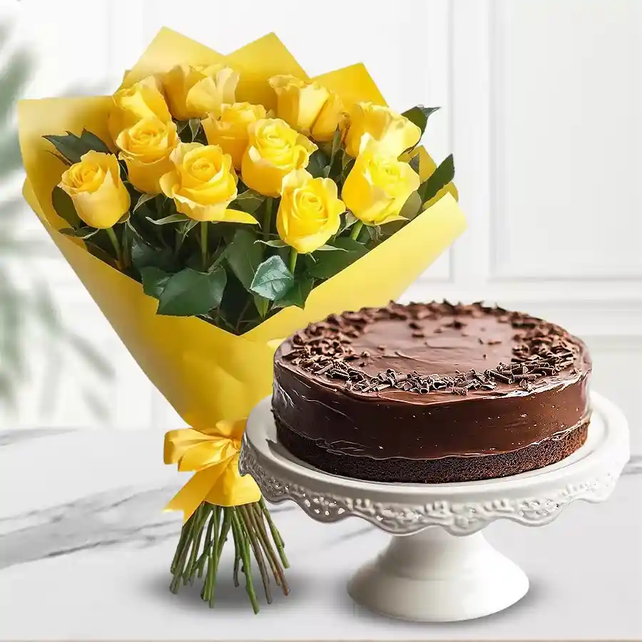 A beautiful combination of 12 yellow roses and a 1 lb chocolate cake, elegantly wrapped in tissue, perfect for gifting.
