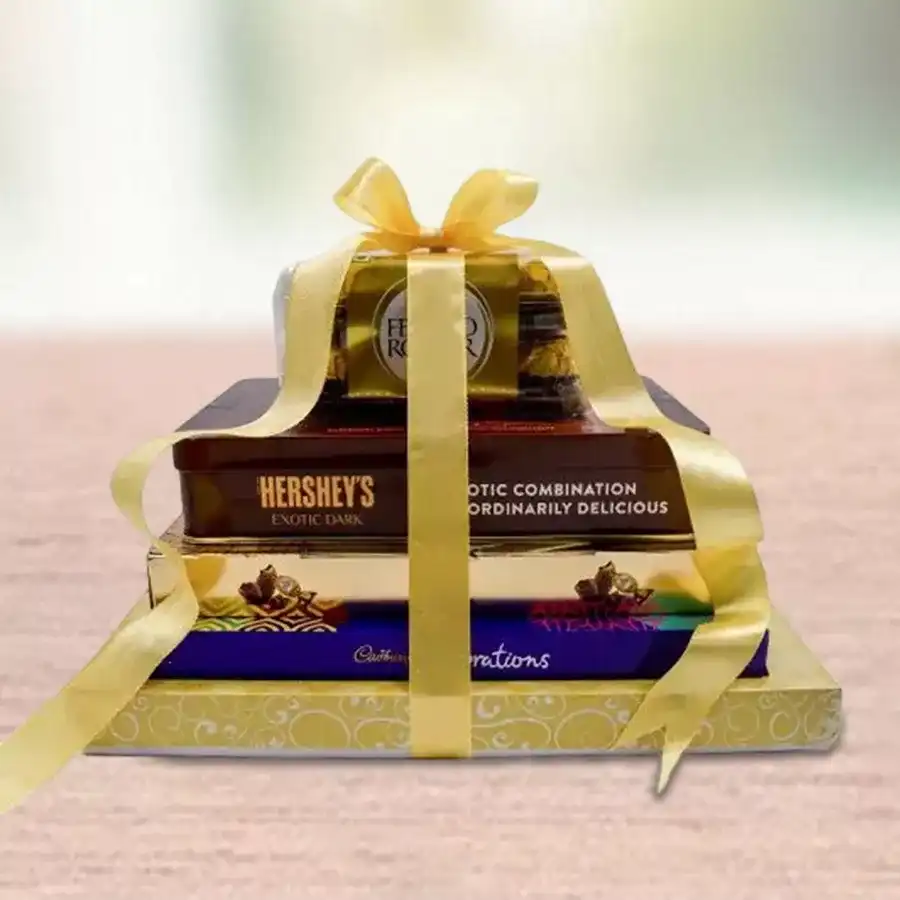 Classic 5 Layered Choco Love Chocolate Tower featuring Ferrero Rocher Moments, Hershey’s Kisses Exotic Dark Chocolate, Cadbury Celebration Assorted Chocolates, decadent premium truffles, and Ferrero Rocher Hazelnut Chocolates.