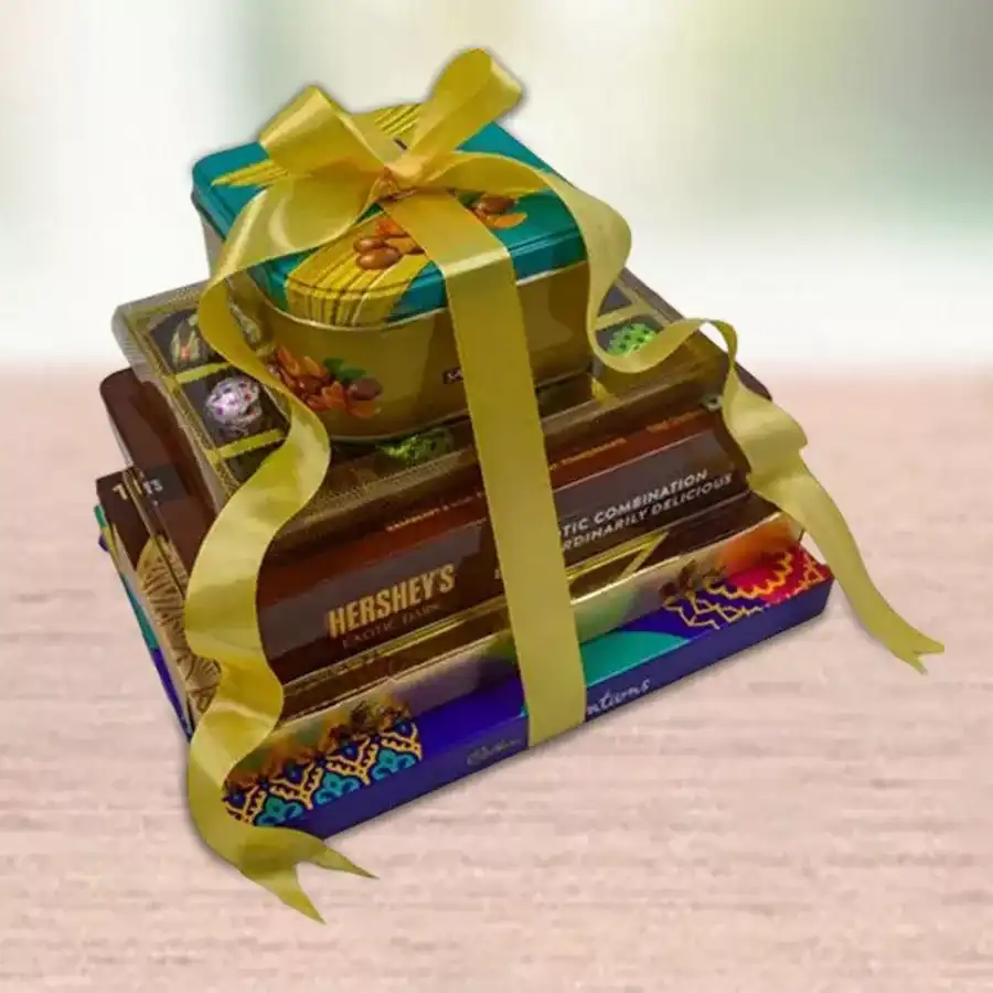 Innovative 5 Layered Chocolate Tower featuring Ferrero Rocher, Hershey’s Exotic Dark Kisses, assorted Cadbury Celebrations, Sapphire Almond chocolates, and handmade crunchy treats, beautifully presented.