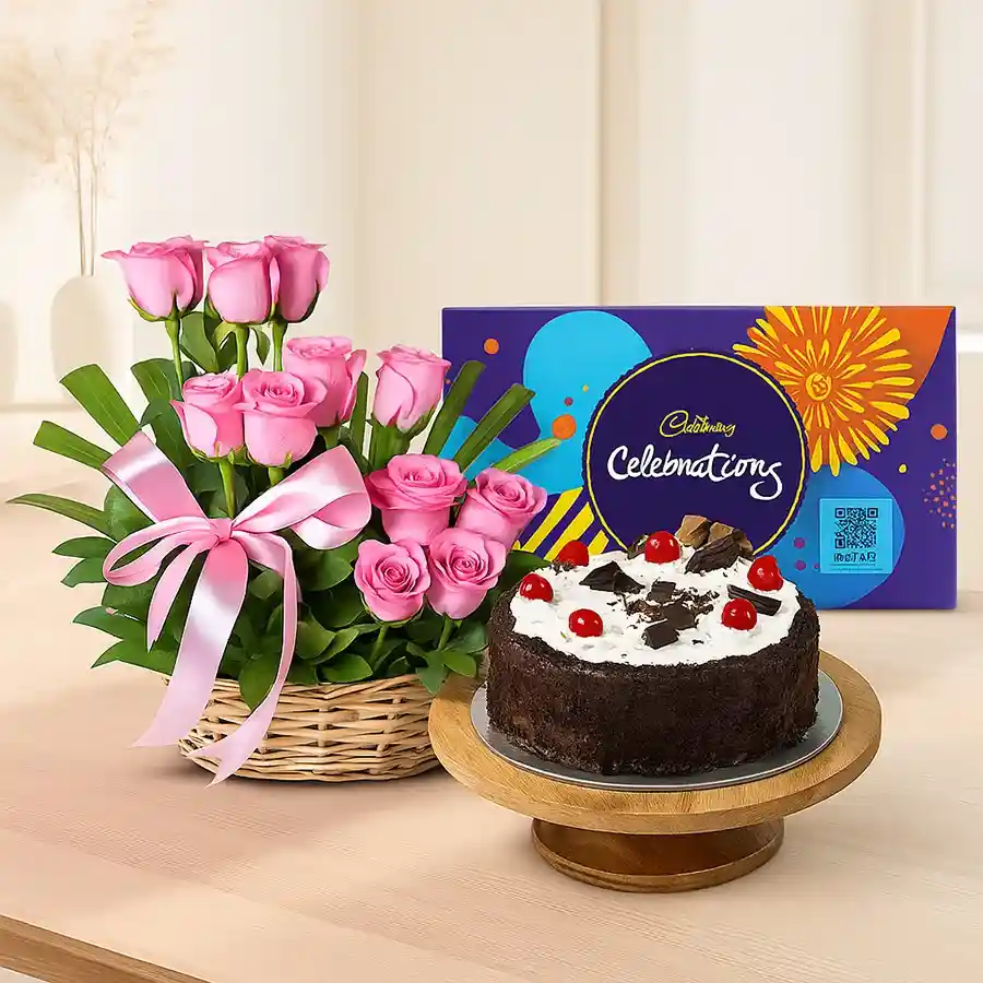 Beautiful pink roses, Black Forest cake, and Cadbury Celebrations in an elegant gift combo.