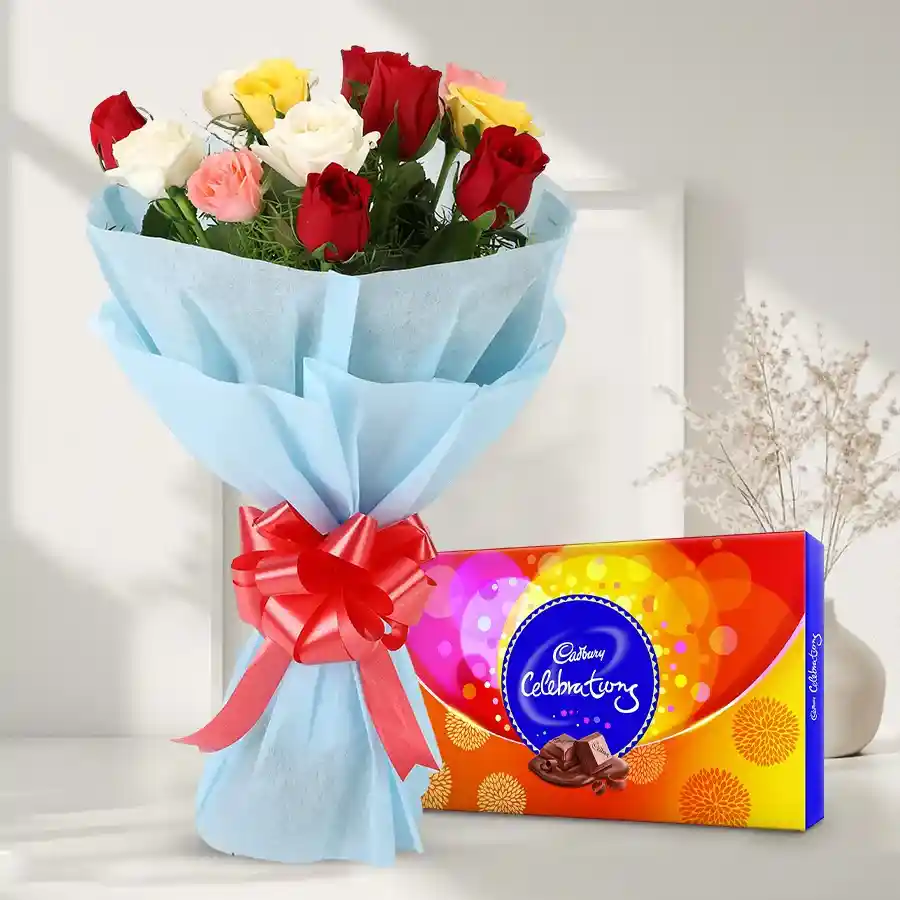 Gorgeous 12 mixed roses bouquet with a Cadbury Celebrations pack.