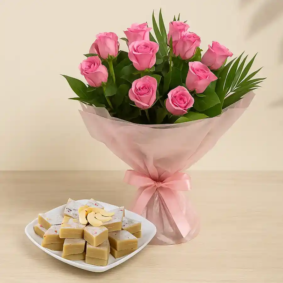 Exquisite gift combo featuring 12 pink roses and 500 gms of Kaju Katli.
