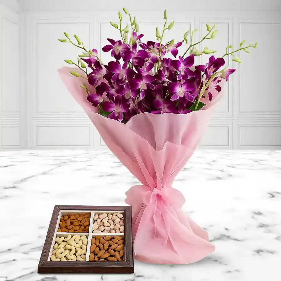 Elegant gift combo of 8 orchids and a 500g dry fruits tray.