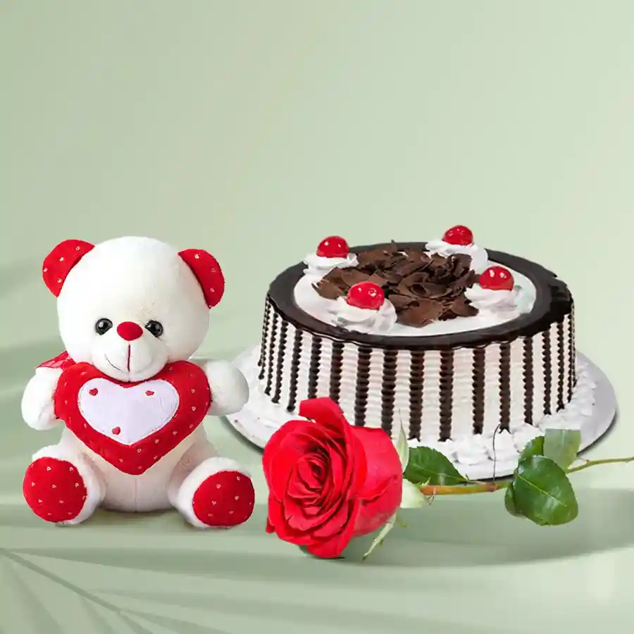 A delightful gift combo featuring a Black Forest Cake, a Red Rose, and a small Teddy bear, designed to bring joy and warmth to celebrations.