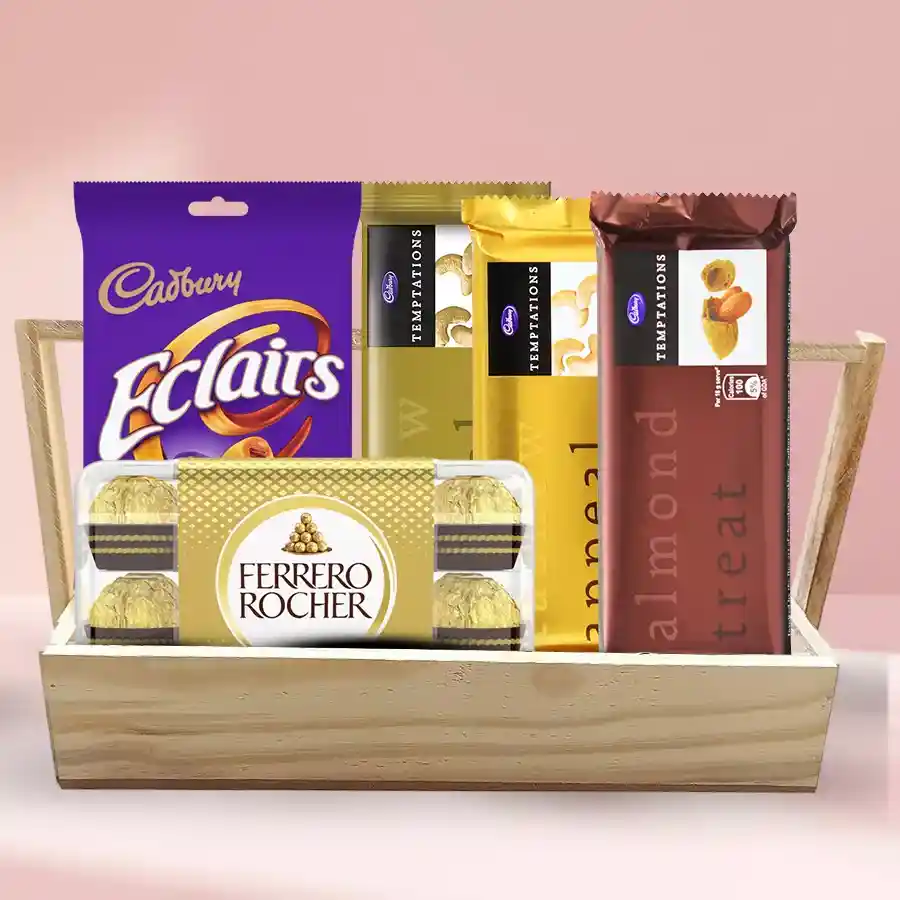 Mouthful Chocolates in a festive tray featuring Ferrero Rocher chocolates, Cadbury Temptation bars, and Cadbury Eclairs arranged in a reusable wooden tray.