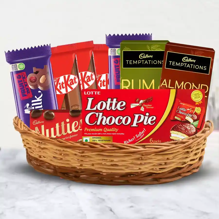 Attractive gift basket filled with assorted chocolates including Cadbury, Nestle, and Lotte treats.