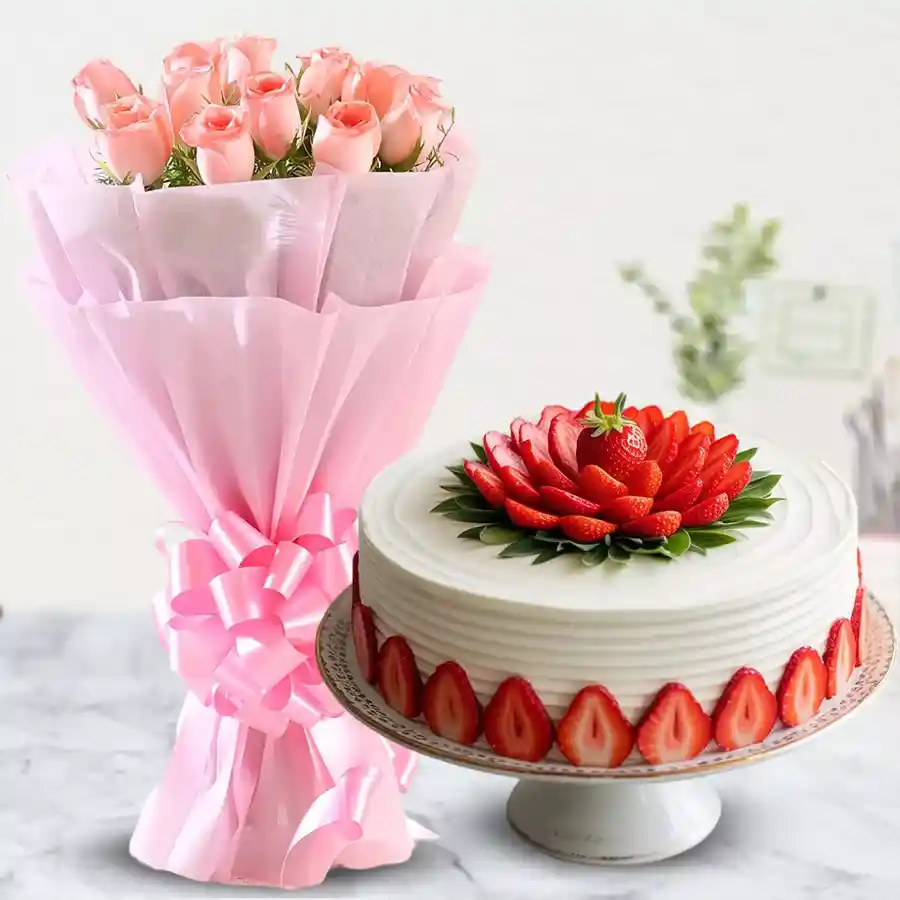 A delightful strawberry cake paired with a bouquet of pink roses, perfect for celebrating special moments.