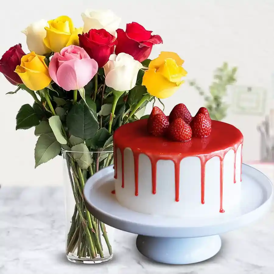 A tempting strawberry cake and assorted roses in a designer vase, perfect gift for Mom.