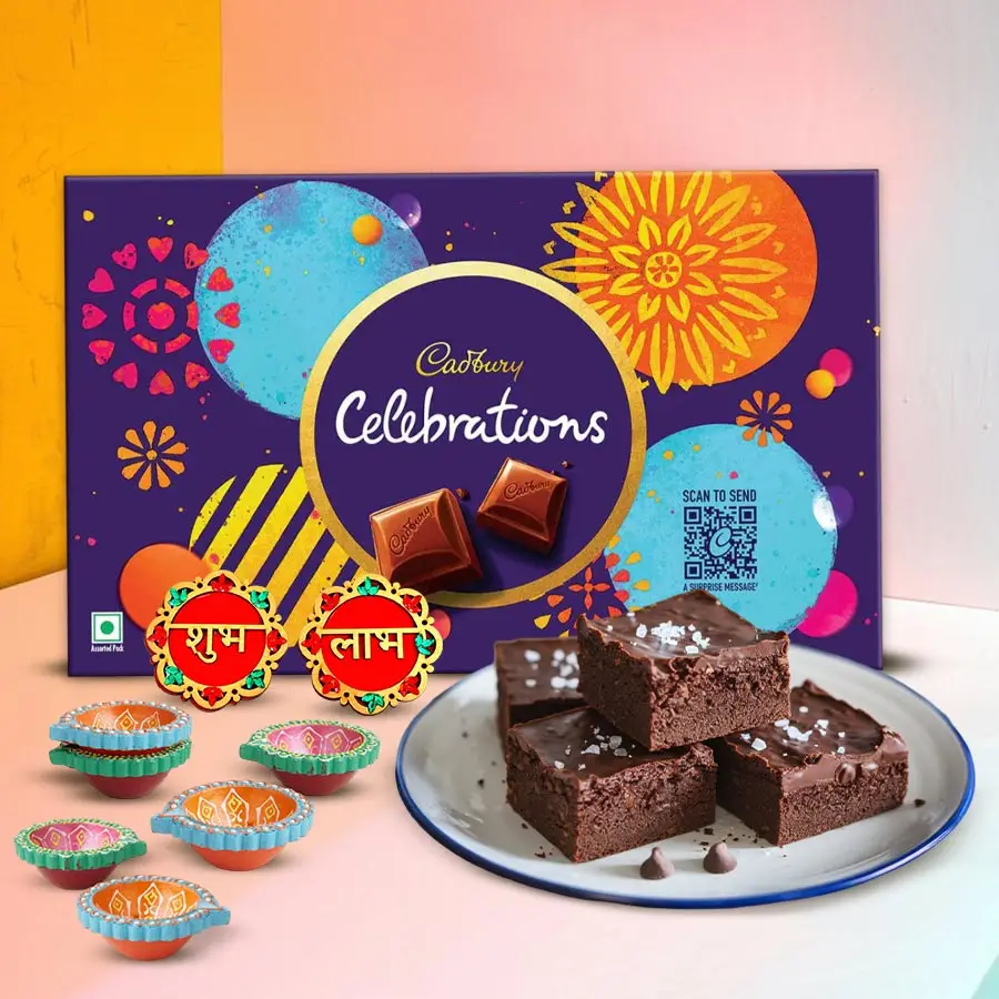 Diwali Delightful Gift Set featuring brownies, Cadbury, wall sticker, and mud diyas.