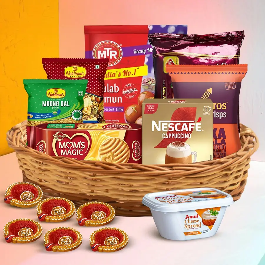 Festive Nibbles & Treats Hamper featuring savory snacks and sweets for Diwali celebration.