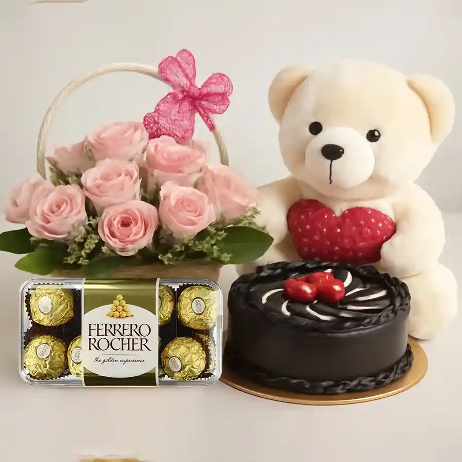 Charming pink roses basket with chocolate cake, teddy, and Ferrero Rocher chocolates.