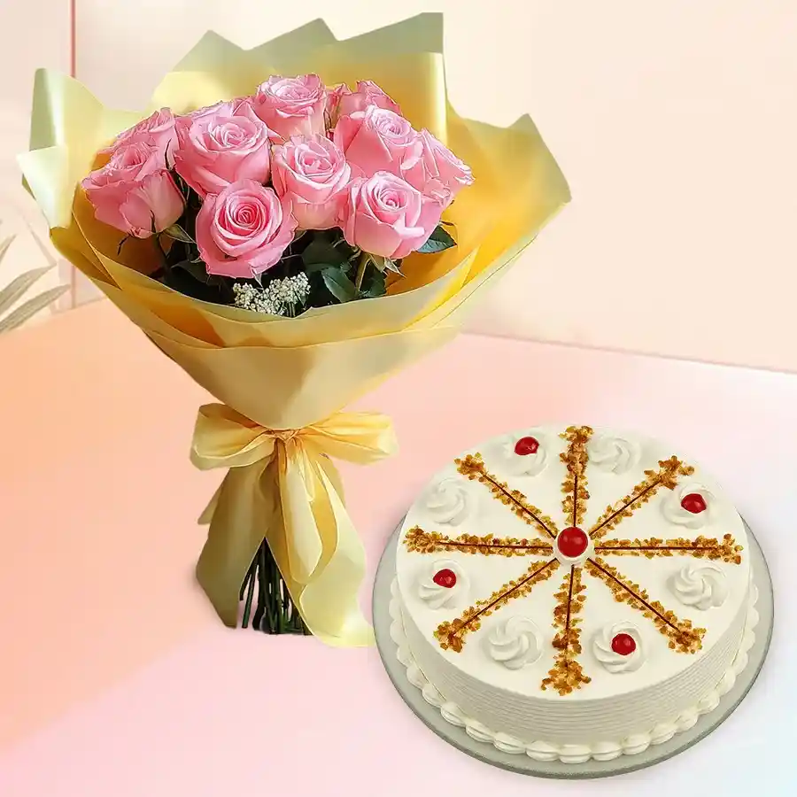 A bunch of 12 pink roses alongside a round butterscotch cake, perfect for celebrations.
