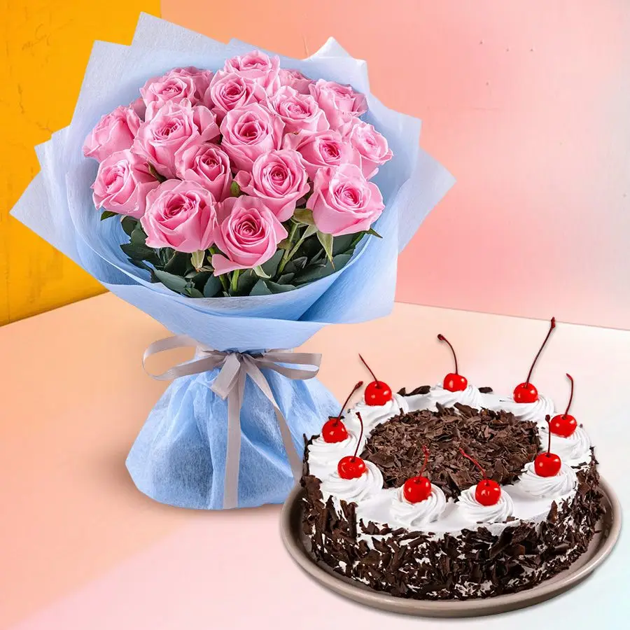 Delicate Pink Roses bouquet with Gypsophila alongside a round Black Forest Cake.