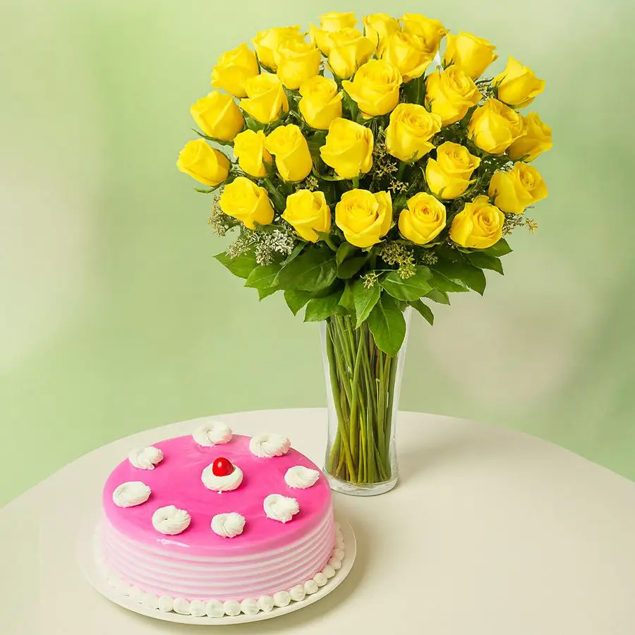 A vibrant arrangement of 36 yellow roses in a vase alongside a round 1kg strawberry cake, perfect for special occasions.