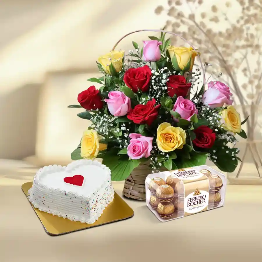 Colorful roses in a basket with heart-shaped vanilla cake and Ferrero Rocher chocolates.