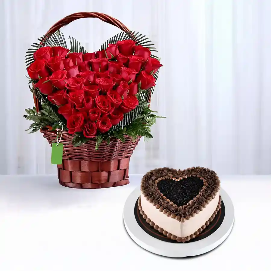 Heart-shaped basket with 50 red roses and a heart-shaped chocolate cake.