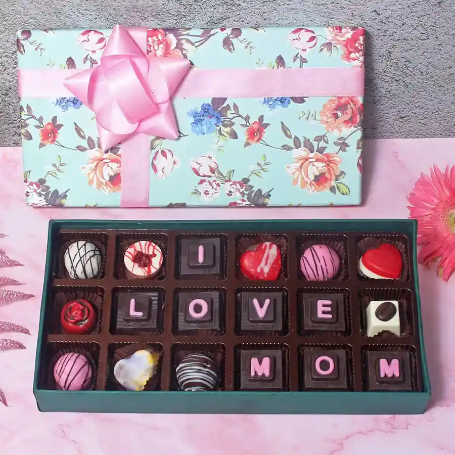 Assorted chocolates in an elegant gift box with "I Love You Mom" messages