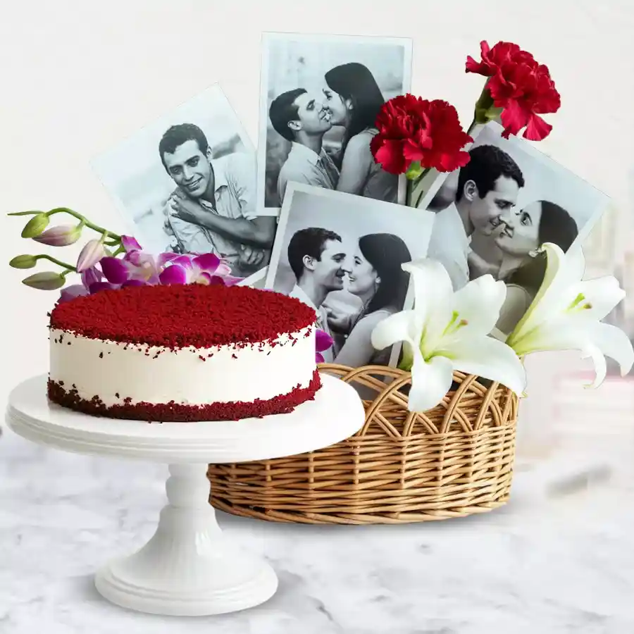 Enchanting floral basket featuring orchids, carnations, white lilies, personalized pictures, and a red velvet cake.