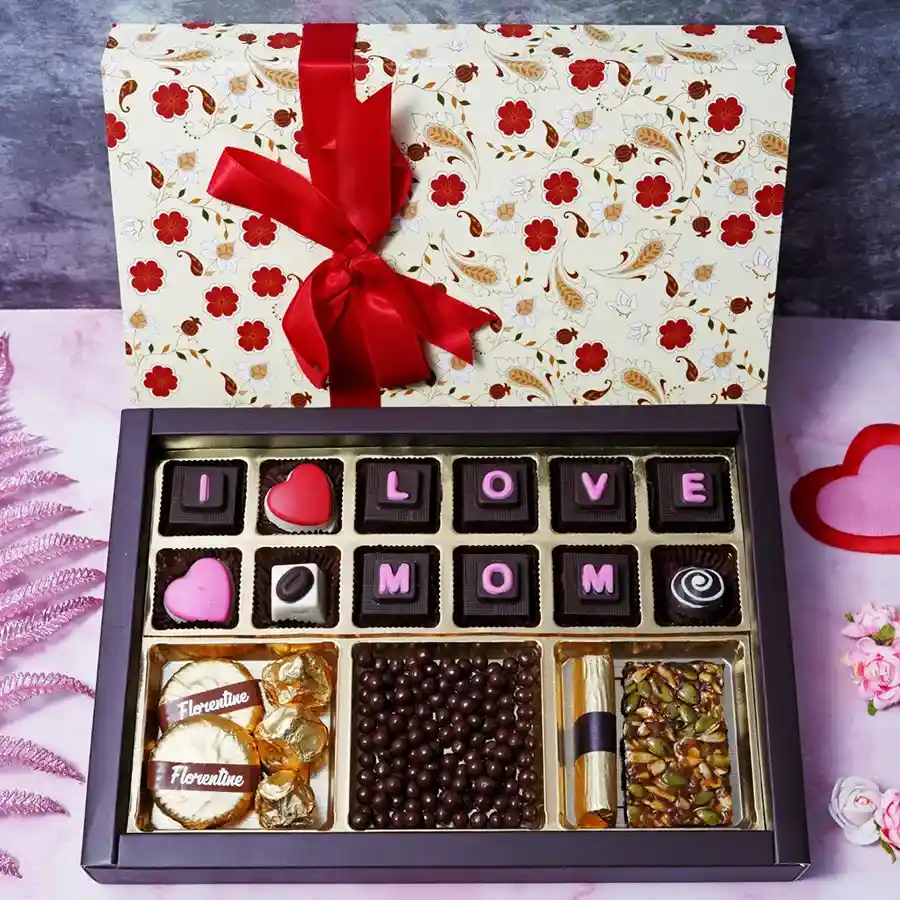 Mother's Day chocolate box filled with assorted chocolates, including Florentines, Rocks, Chocolated Butterscotch, a Log, Seeds Squares, and Truffles.