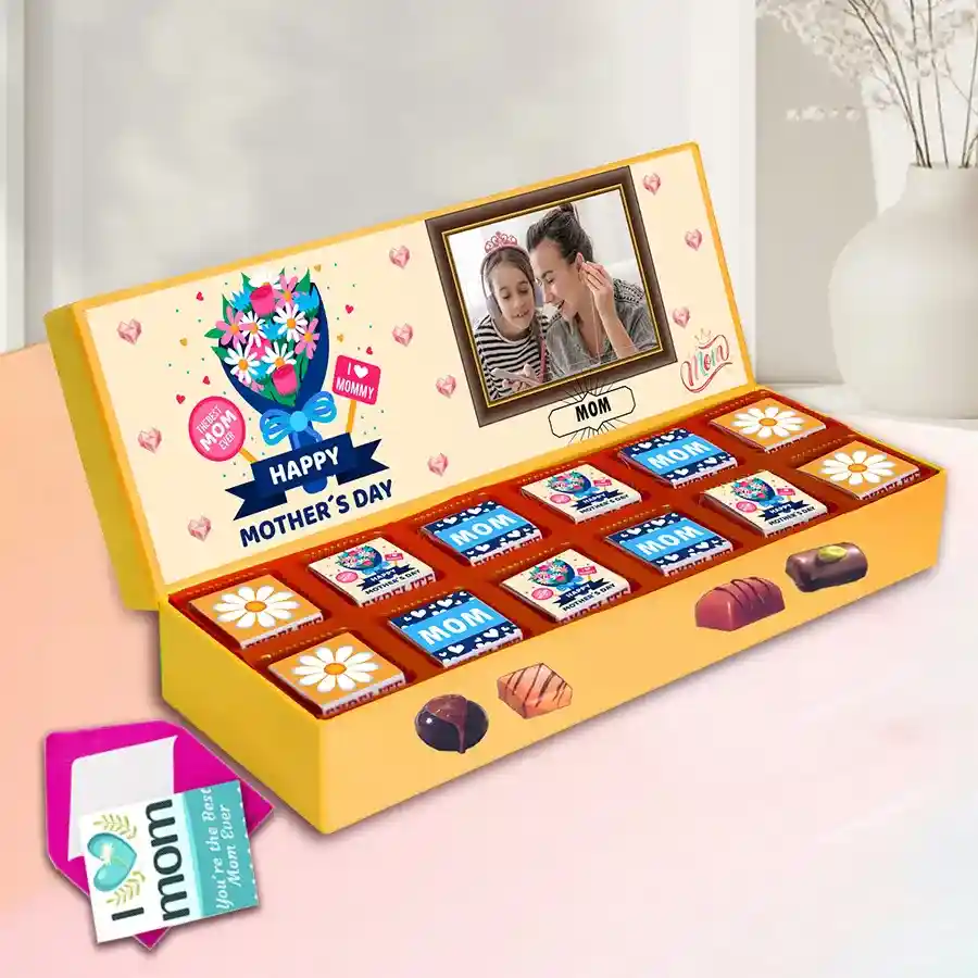 Assorted chocolates in a personalized box with Mother's Day theme, featuring flavors like Roasted Dry Fruit, Cranberry, Paan, Butterscotch, Mixed Fruits, and Chocochip, alongside a heartfelt greetings card.