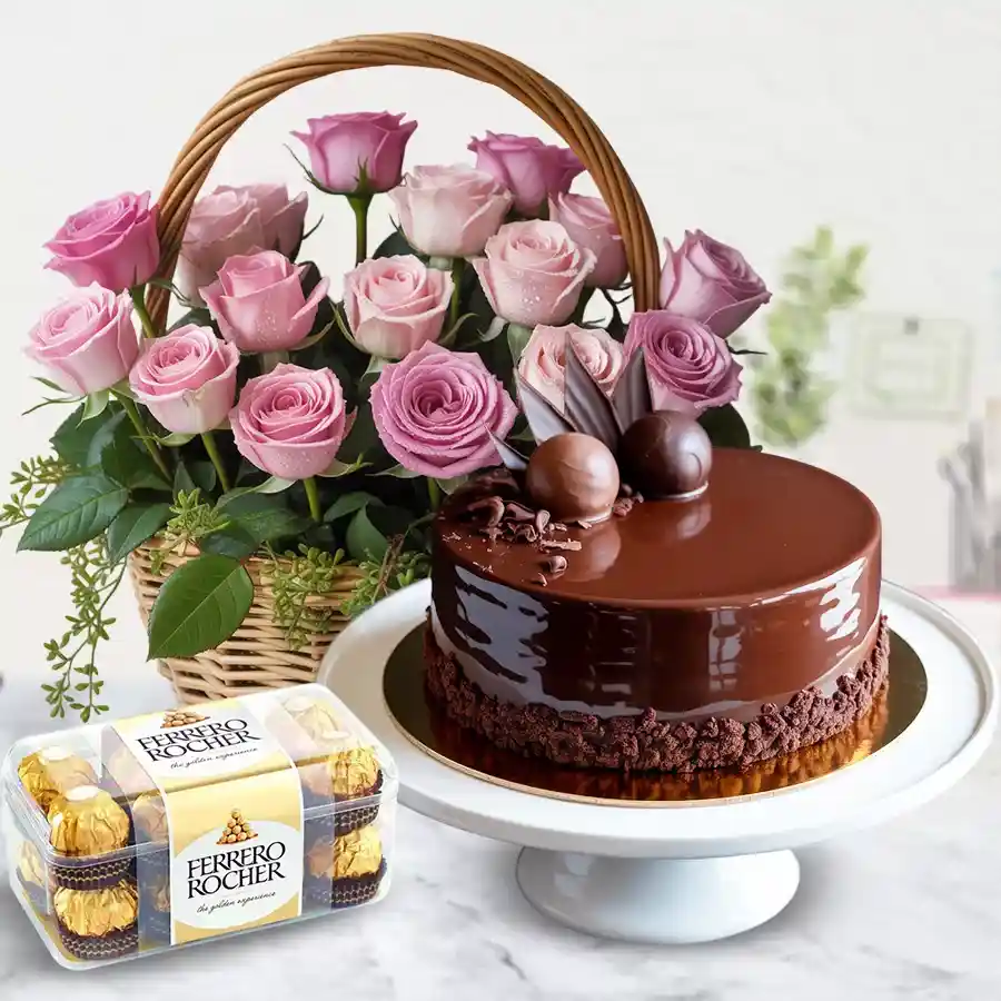 Charming gift of pink roses basket with chocolate truffle cake and Ferrero Rocher chocolates.