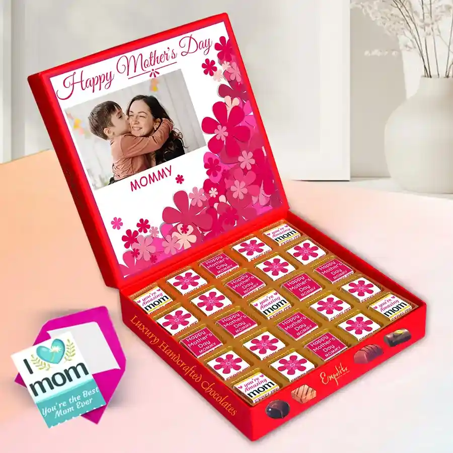 A beautifully arranged customized box filled with 25 assorted chocolates in various flavors, with a personalized touch featuring a name and photo, alongside a heartfelt greeting card.