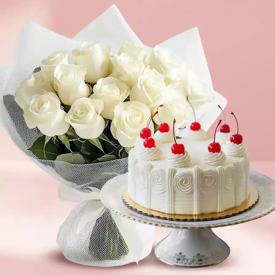 A bouquet of 12 white roses and an eggless White Forest cake, beautifully wrapped and presented, symbolizing elegance and love.