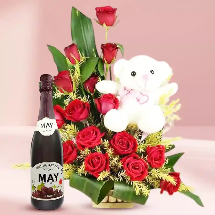 Adorable teddy sitting in a rose basket with fruit juice.