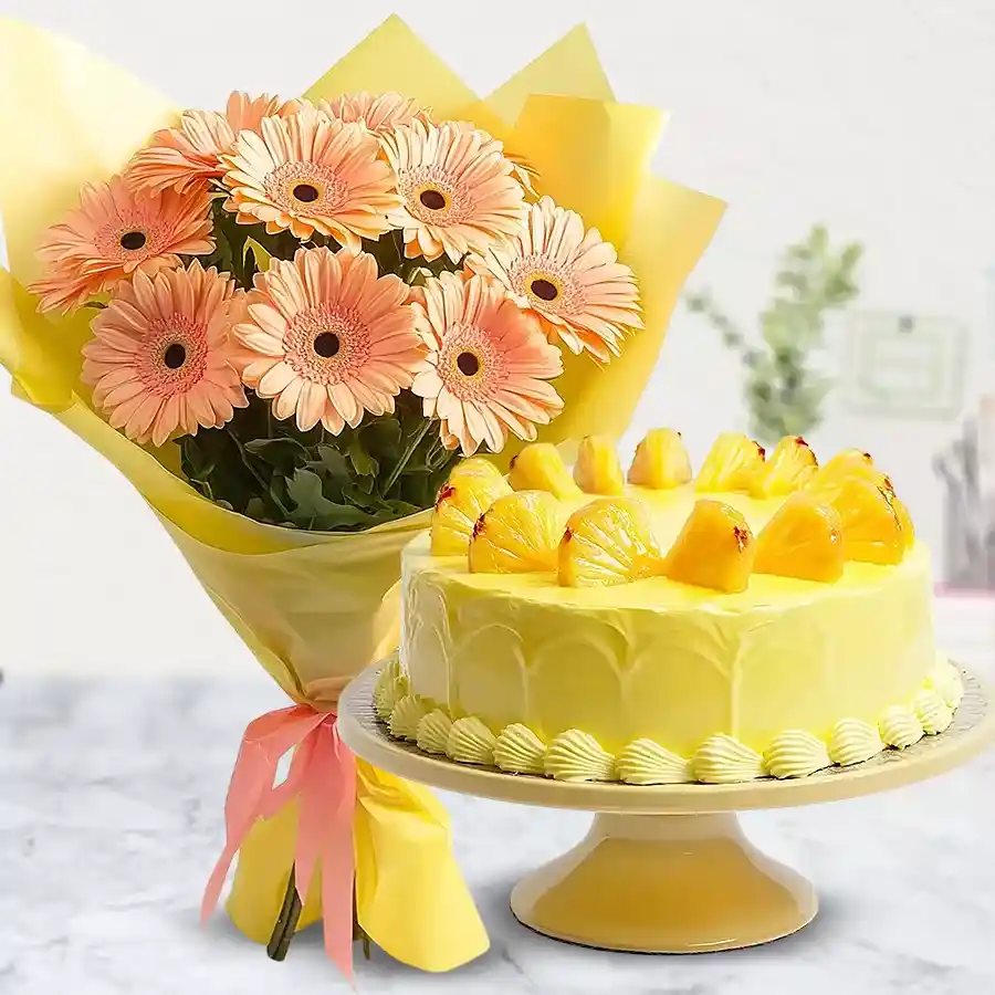 Bouquet of peach gerberas and a pineapple cake combo for special occasions.