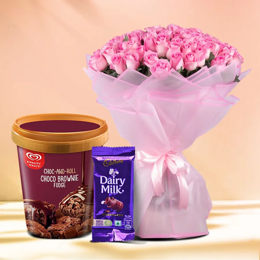 Luxurious gift combo featuring pink roses, brownie ice cream, and Cadbury chocolate bar.