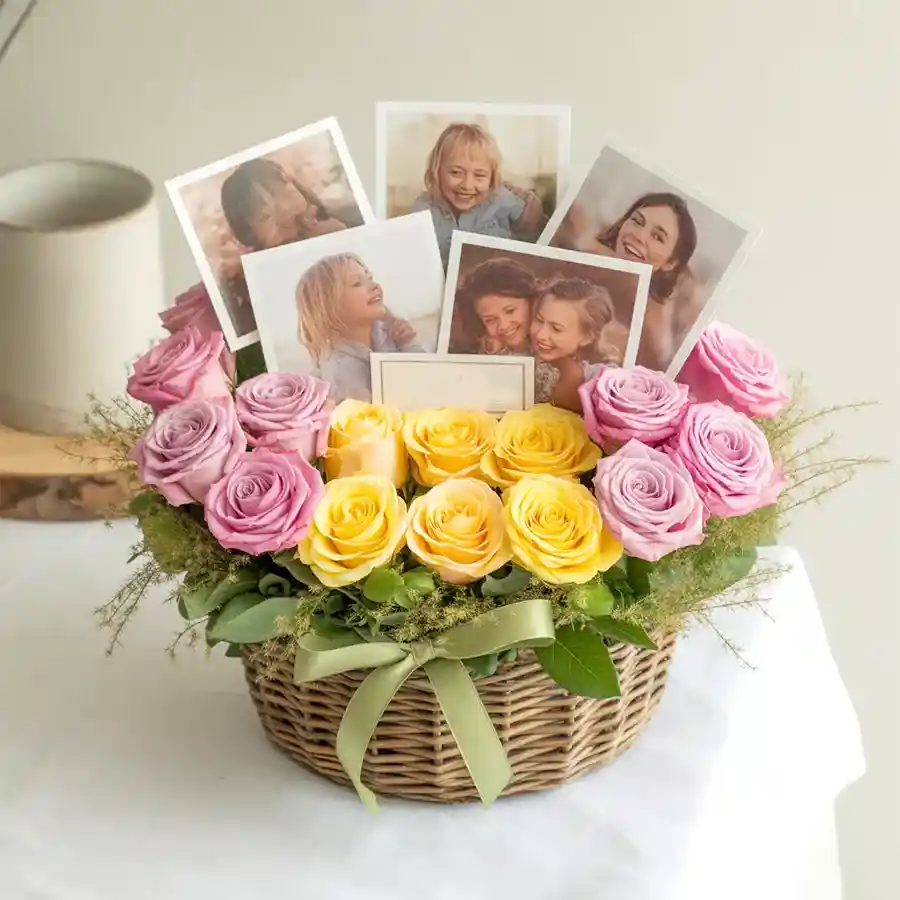 Vibrant basket of pink and yellow roses with personalized photos.