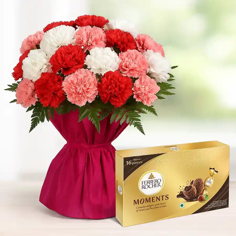 Multicolored carnations bouquet with Ferrero Rocher chocolates, elegantly wrapped, perfect for gifting.