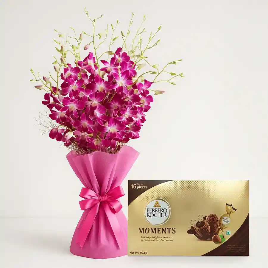 A beautiful bouquet of 8 orchids alongside a box of 16 Ferrero Rocher Moment chocolates, an ideal gift for any occasion.