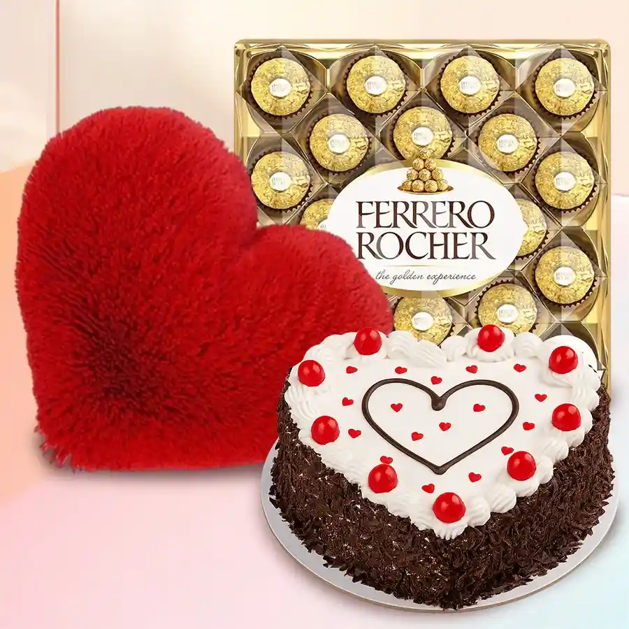 Heartfelt gift bundle featuring a heart-shaped cake, Ferrero Rocher chocolates, and a red heart cushion.