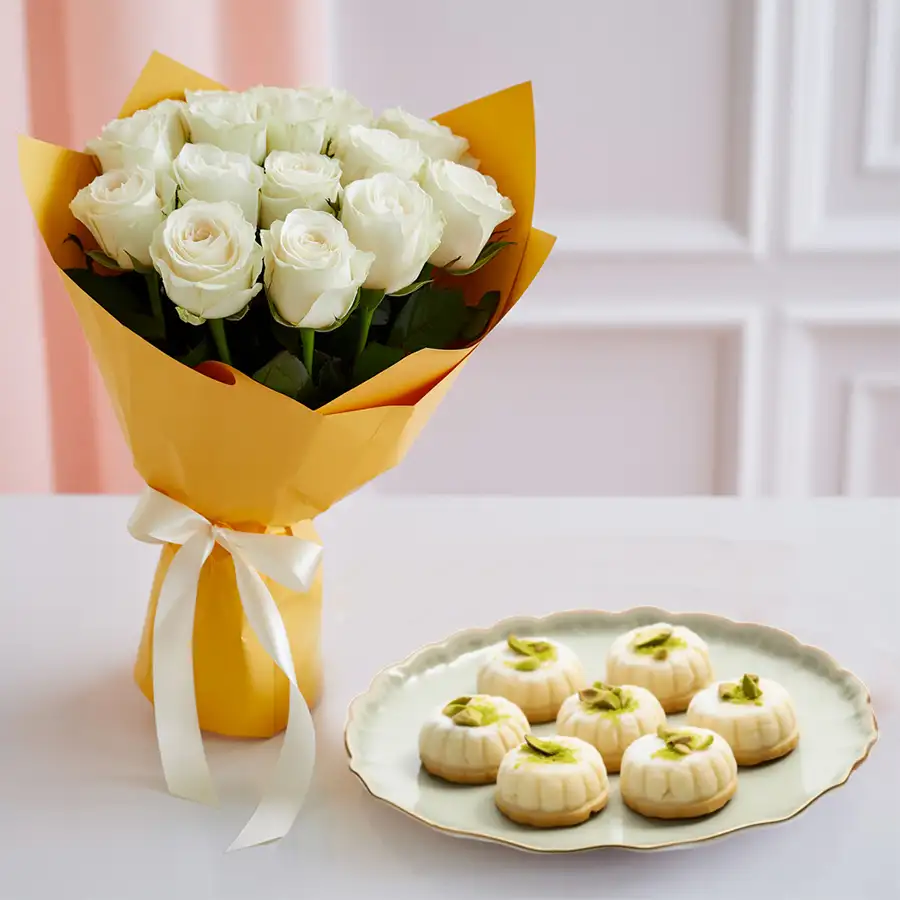 Gift set featuring a bunch of 10 white tuberoses alongside 20 pieces of traditional sandesh sweets.