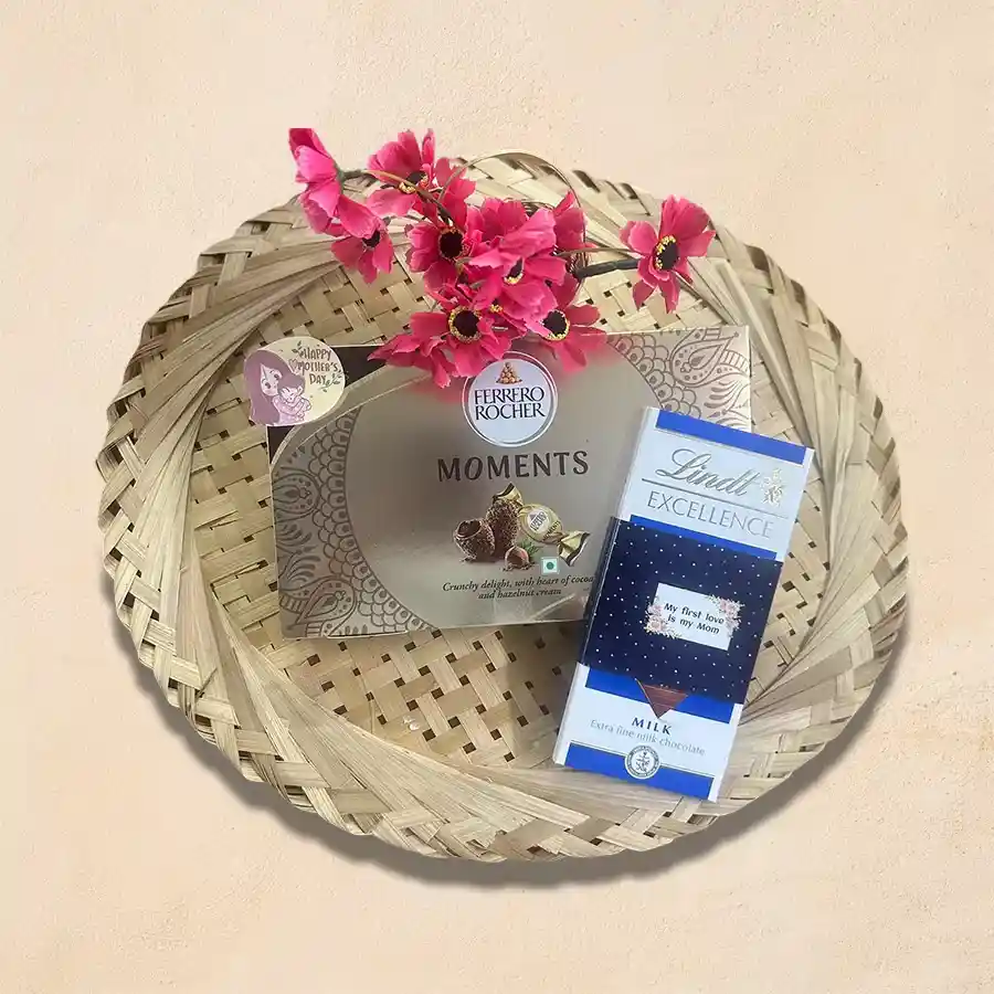 Premium Chocolaty Paradise gift set featuring Lindt Excellence Extra Creamy Chocolate Bar and Ferrero Rocher Moments Chocolate, elegantly arranged for Mother's Day celebration.